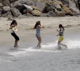 Miley Cyrus filming Hannah Montana on the beach in Malibu
