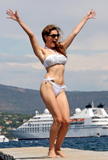 Kelly Brook show off her body in white bikini posing for paparazzi on the French Riviera